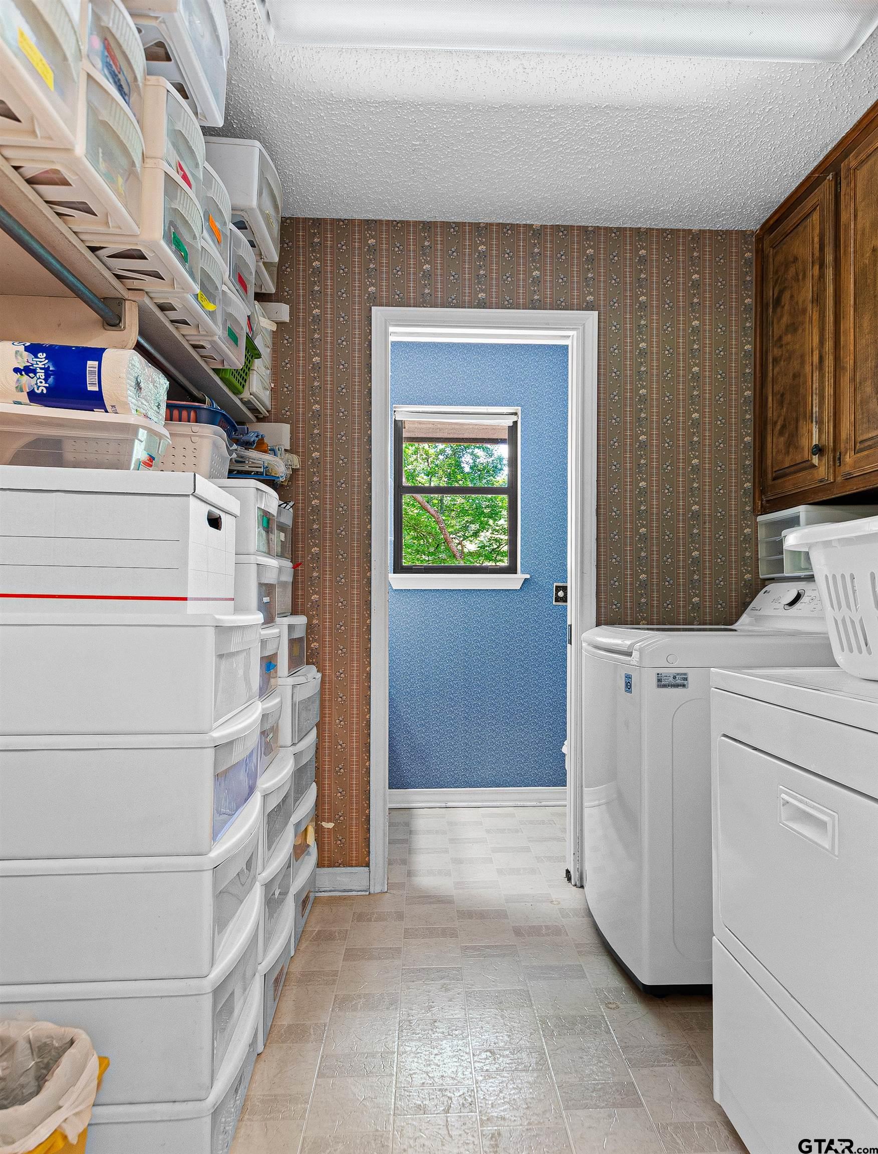18862 Big Timber Road Tyler, TX 75703 - Photo 18 of 33 a view of walk in closet with clothes and shoes