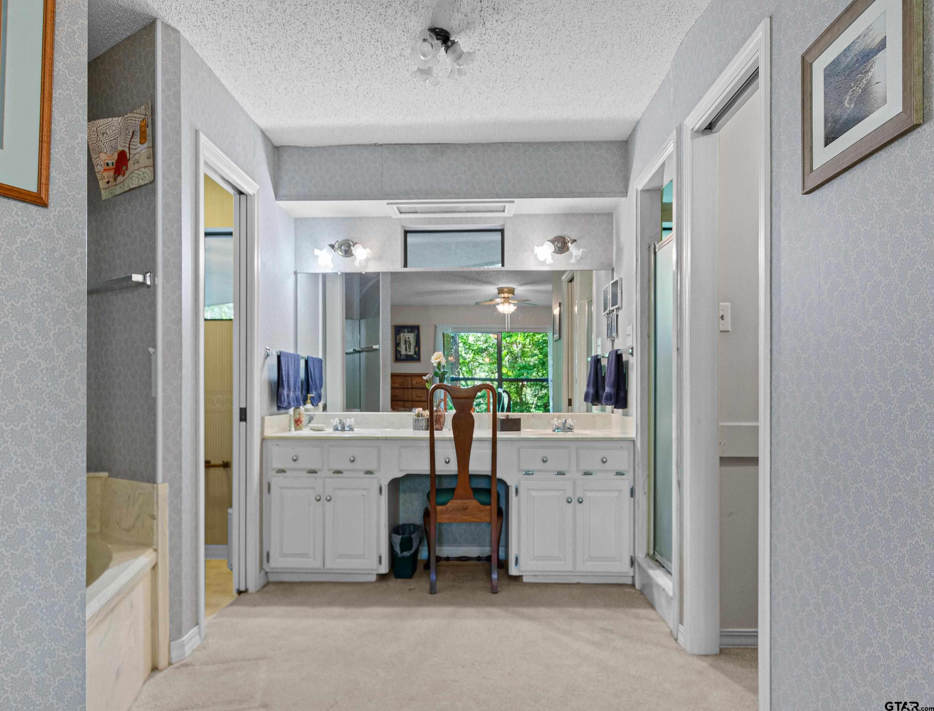 18862 Big Timber Road Tyler, TX 75703 - Photo 21 of 33 a living room with furniture and a chandelier