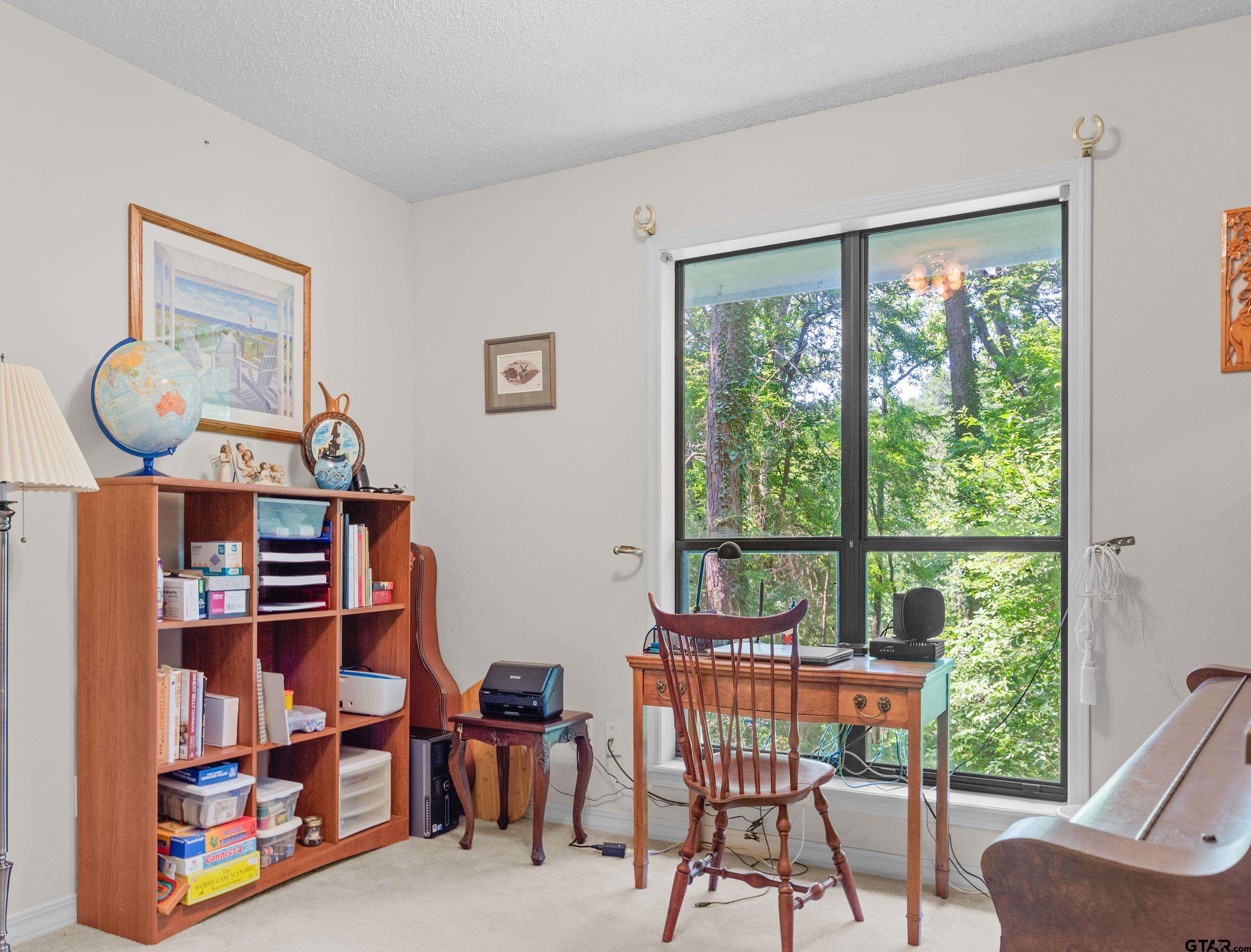 18862 Big Timber Road Tyler, TX 75703 - Photo 23 of 33 a view of a livingroom with furniture and a window