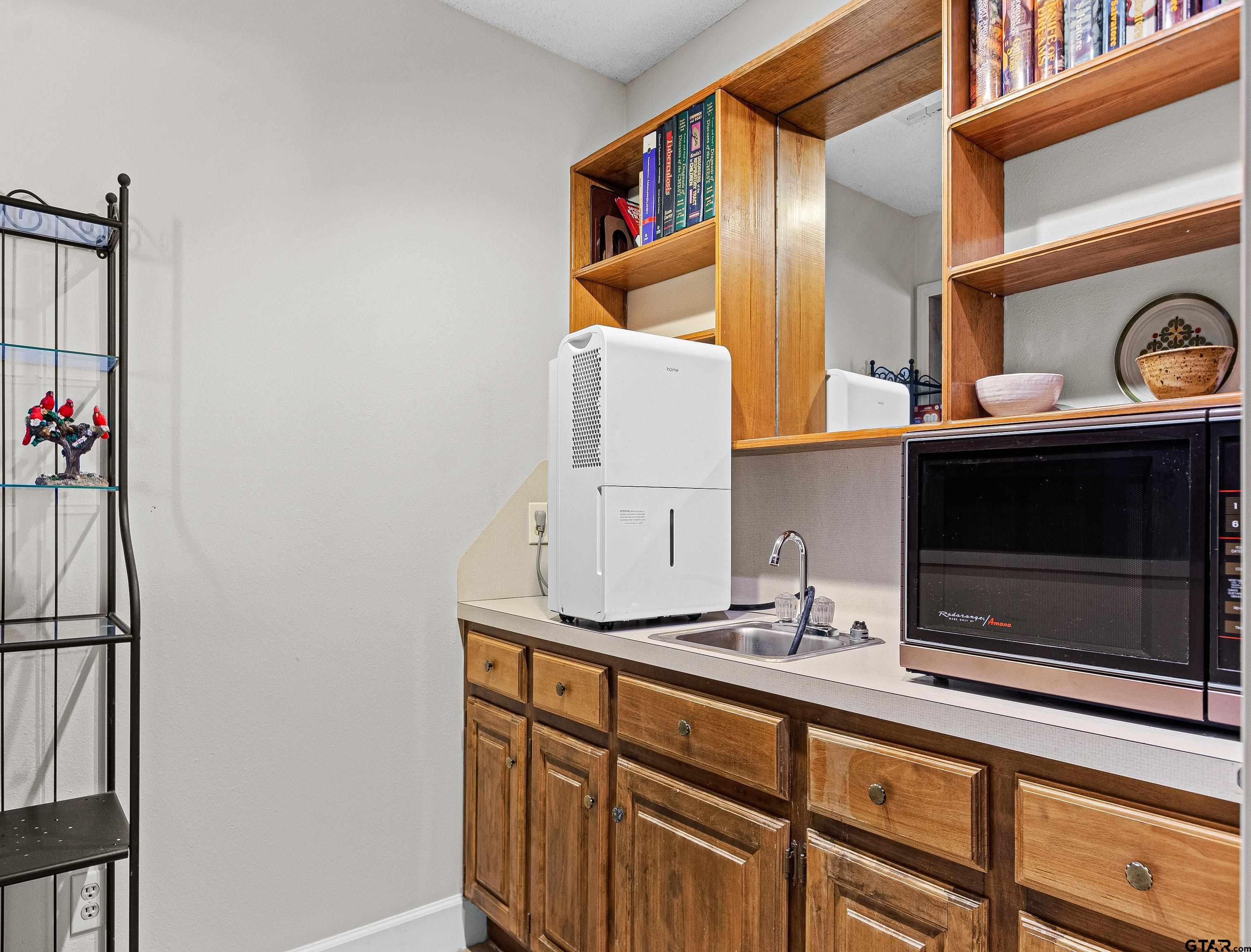 18862 Big Timber Road Tyler, TX 75703 - Photo 27 of 33 a bathroom with a sink and a mirror