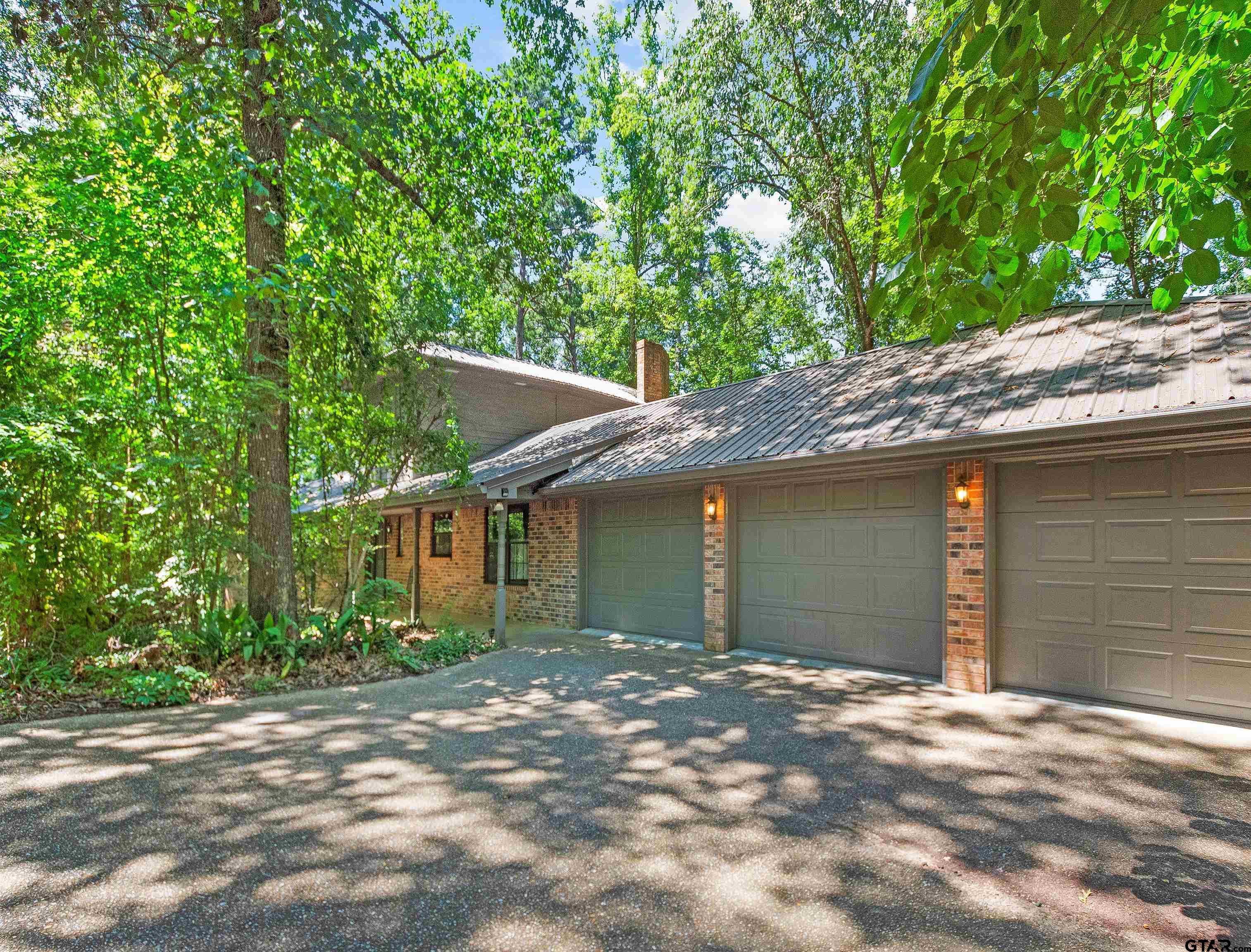 18862 Big Timber Road Tyler, TX 75703 - Photo 4 of 33 a front view of a house with a garage