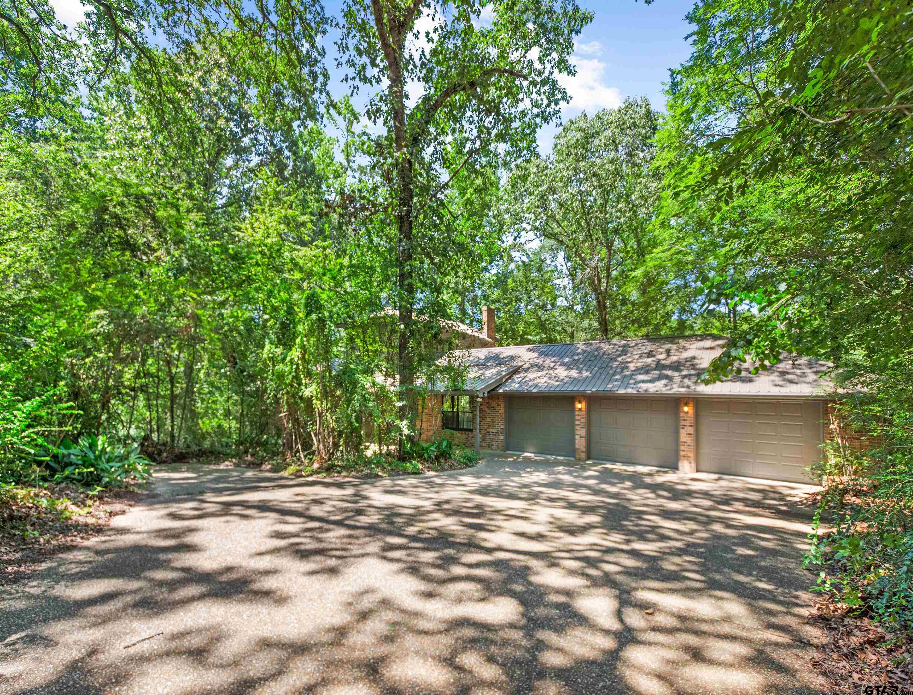 18862 Big Timber Road Tyler, TX 75703 - Photo 6 of 33 a view of a house with a yard and tree