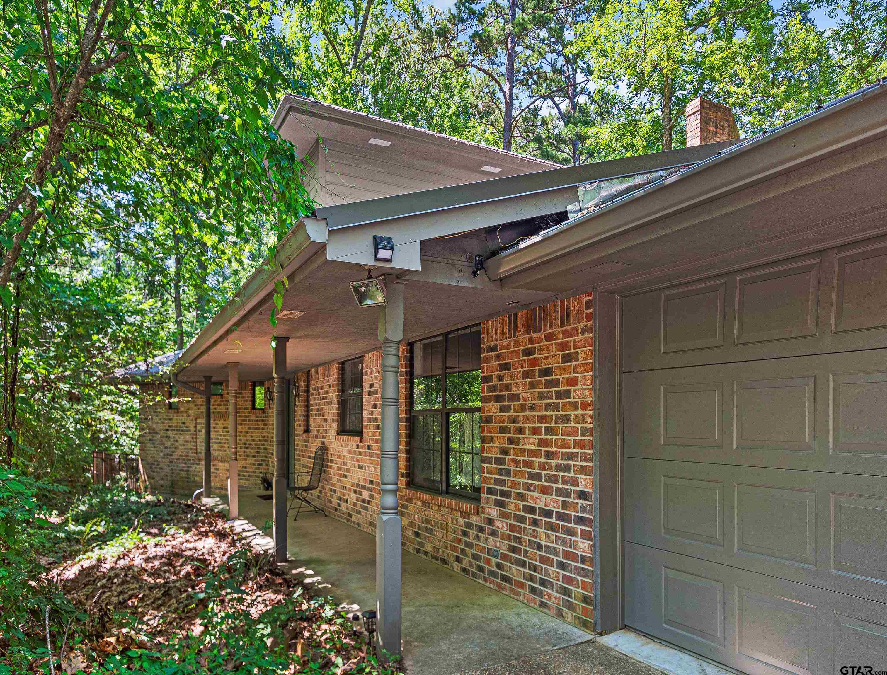 18862 Big Timber Road Tyler, TX 75703 - Photo 7 of 33 a brick house with a large window