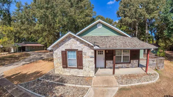 a front view of a house with yard