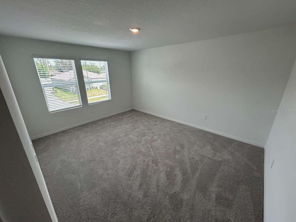 1140 Hour Glass Road Lakeland, FL 33801 - Photo 16 of 24 an empty room with a window
