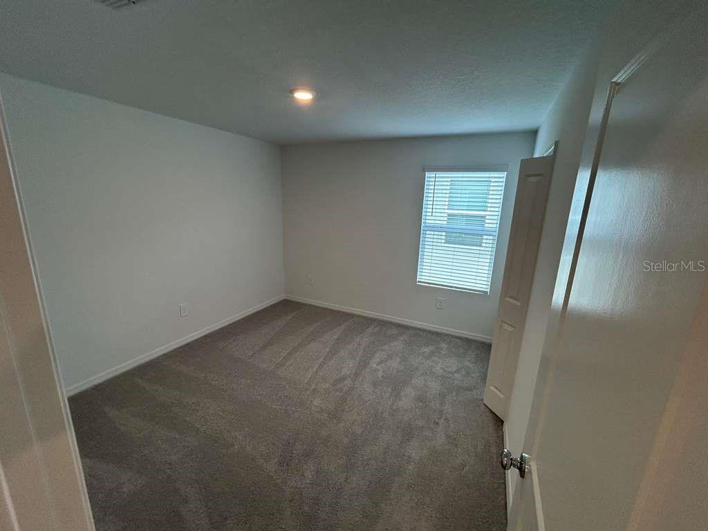 1140 Hour Glass Road Lakeland, FL 33801 - Photo 17 of 24 an empty room with windows