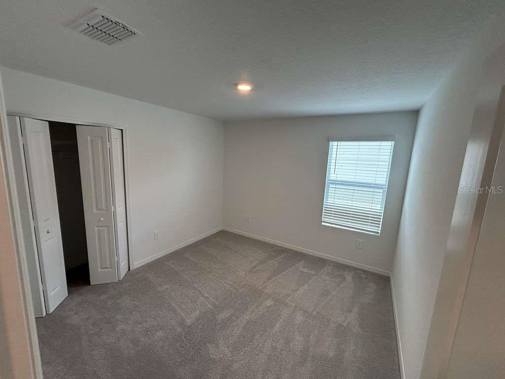 1140 Hour Glass Road Lakeland, FL 33801 - Photo 18 of 24 an empty room with a window