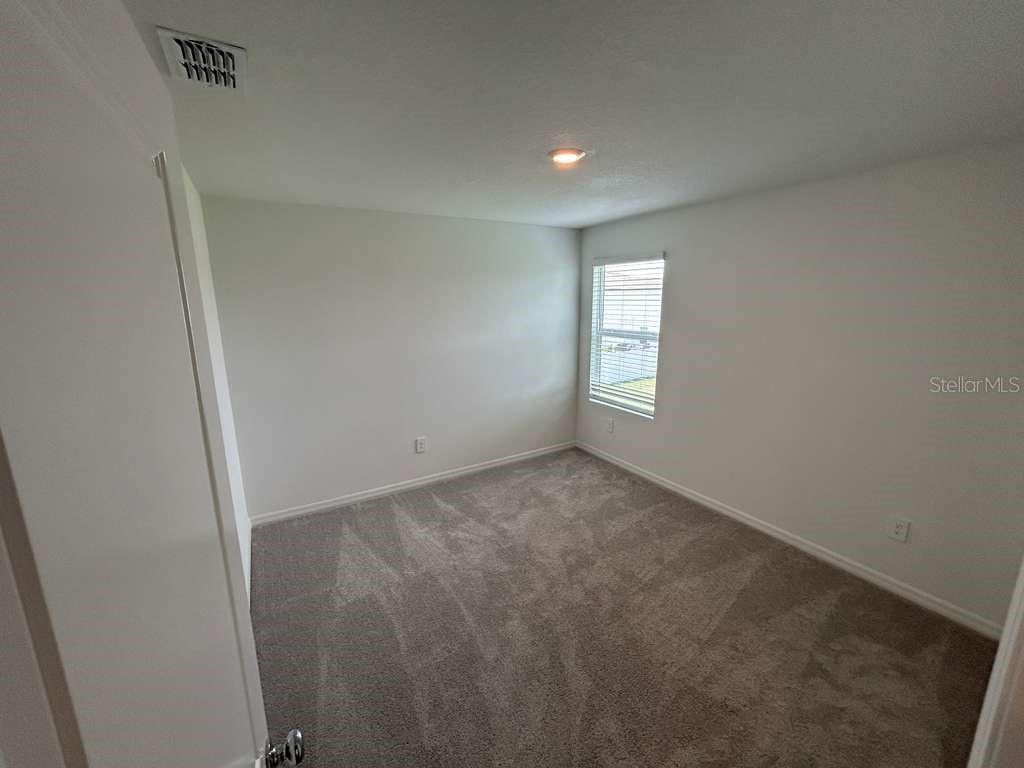 1140 Hour Glass Road Lakeland, FL 33801 - Photo 19 of 24 an empty room with windows