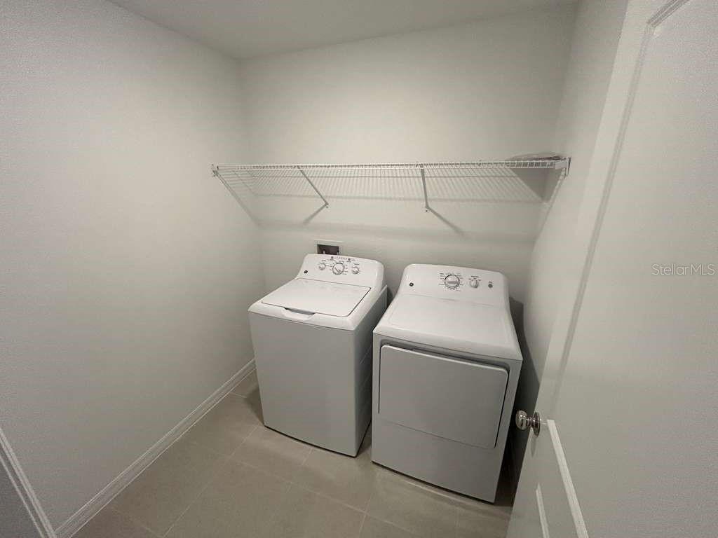 1140 Hour Glass Road Lakeland, FL 33801 - Photo 21 of 24 a utility room with dryer and washer