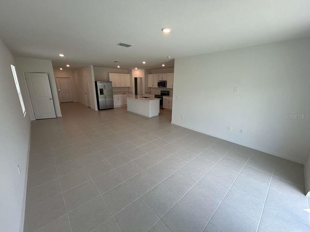 1140 Hour Glass Road Lakeland, FL 33801 - Photo 3 of 24 a view of a kitchen with a sink and a refrigerator