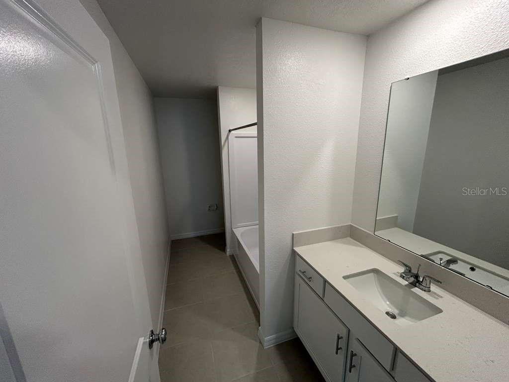 1140 Hour Glass Road Lakeland, FL 33801 - Photo 9 of 24 a bathroom with a sink and a mirror