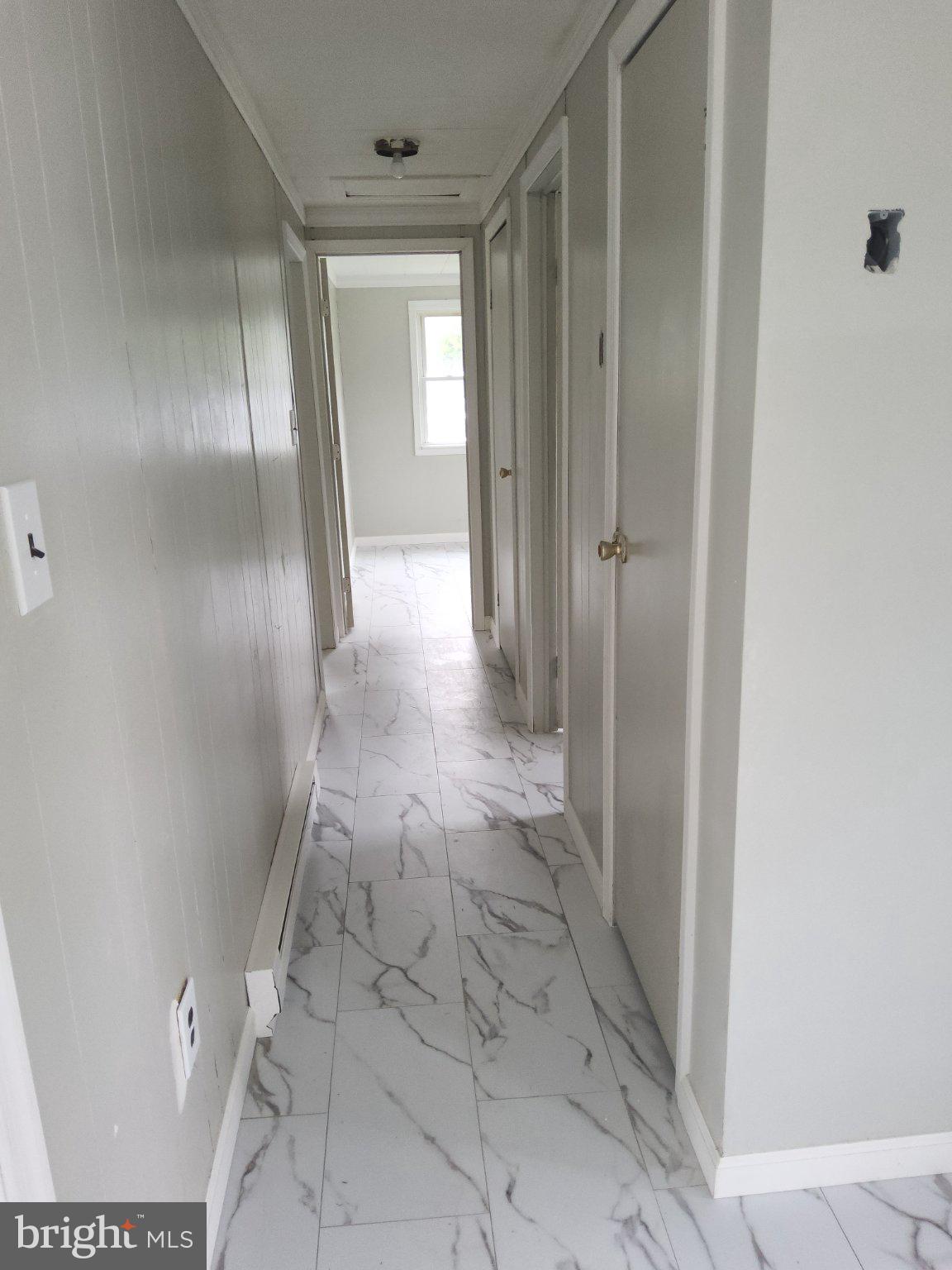 4212 Railroad Road Hurlock, MD 21643 - Photo 6 of 8 Bright and airy hallway with elegance.