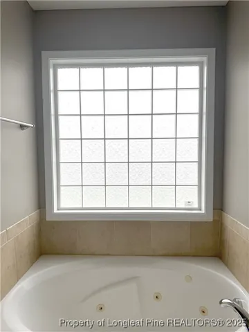a view of a bath tub sitting in a bathroom