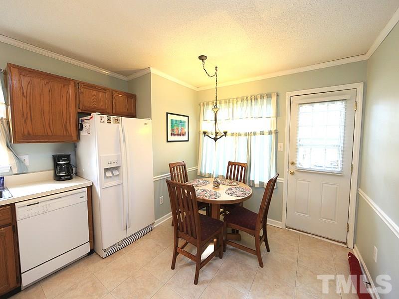 7301 Ewing Place Raleigh, NC 27616 - Photo 6 of 12 a dining room with furniture and window