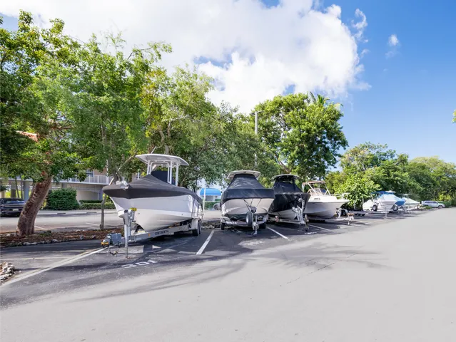 a view of a patio with a table and chairs under an umbrella