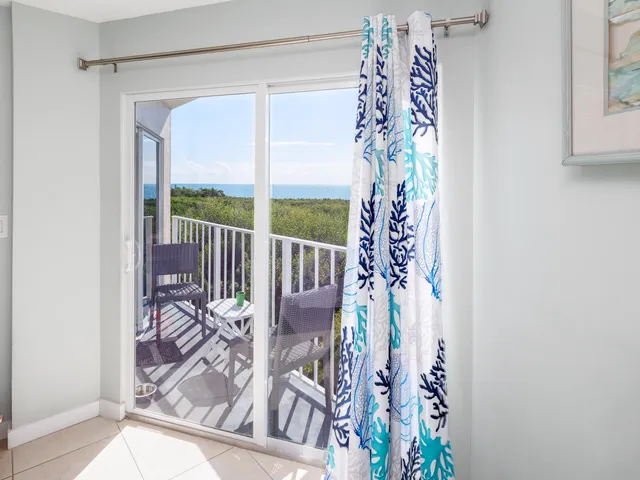 a view of a balcony with wooden floor