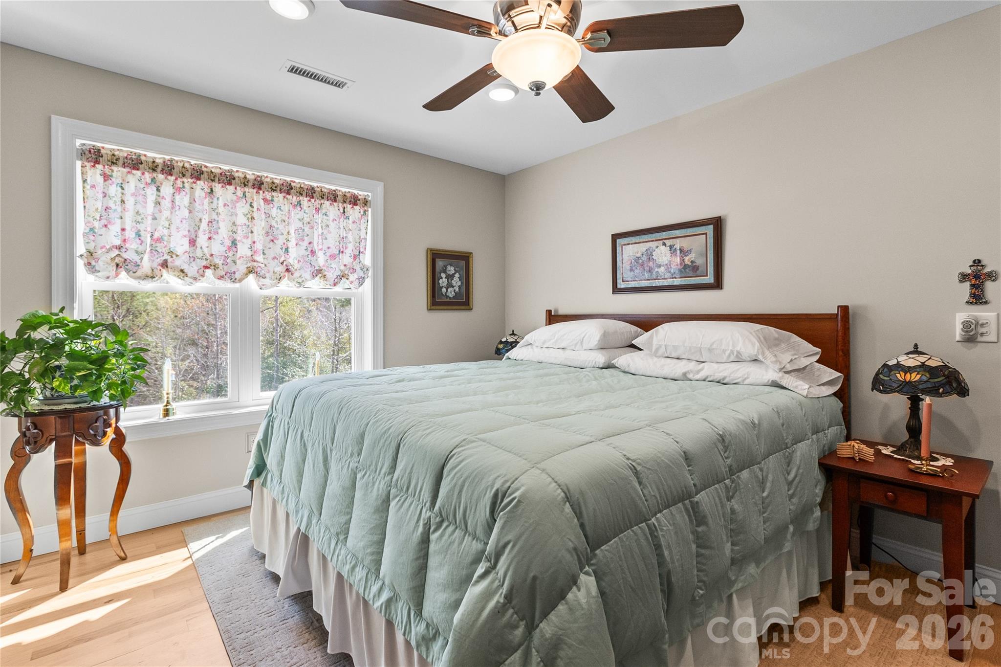 1103 River Ridge Way Lenoir, NC 28645 - Photo 23 of 46 a bedroom with a bed and a chandelier