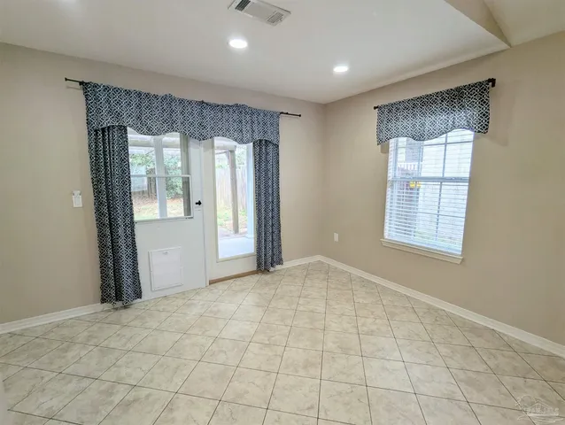 a view of an empty room and window