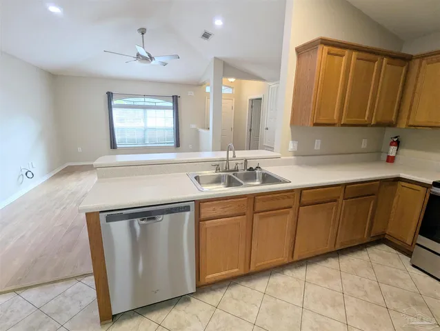 a spacious bathroom with a sink and a mirror