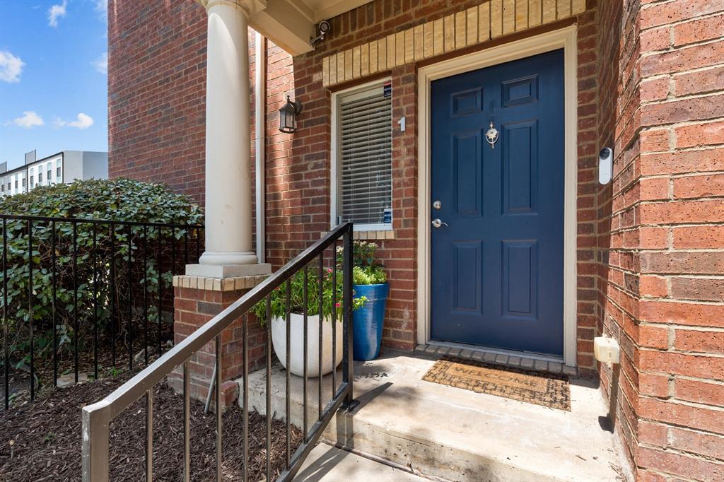 4904 Live Oak Street, Unit 1 Dallas, TX 75206 - Photo 1 of 1 a view of a house with wooden fence and potted plants