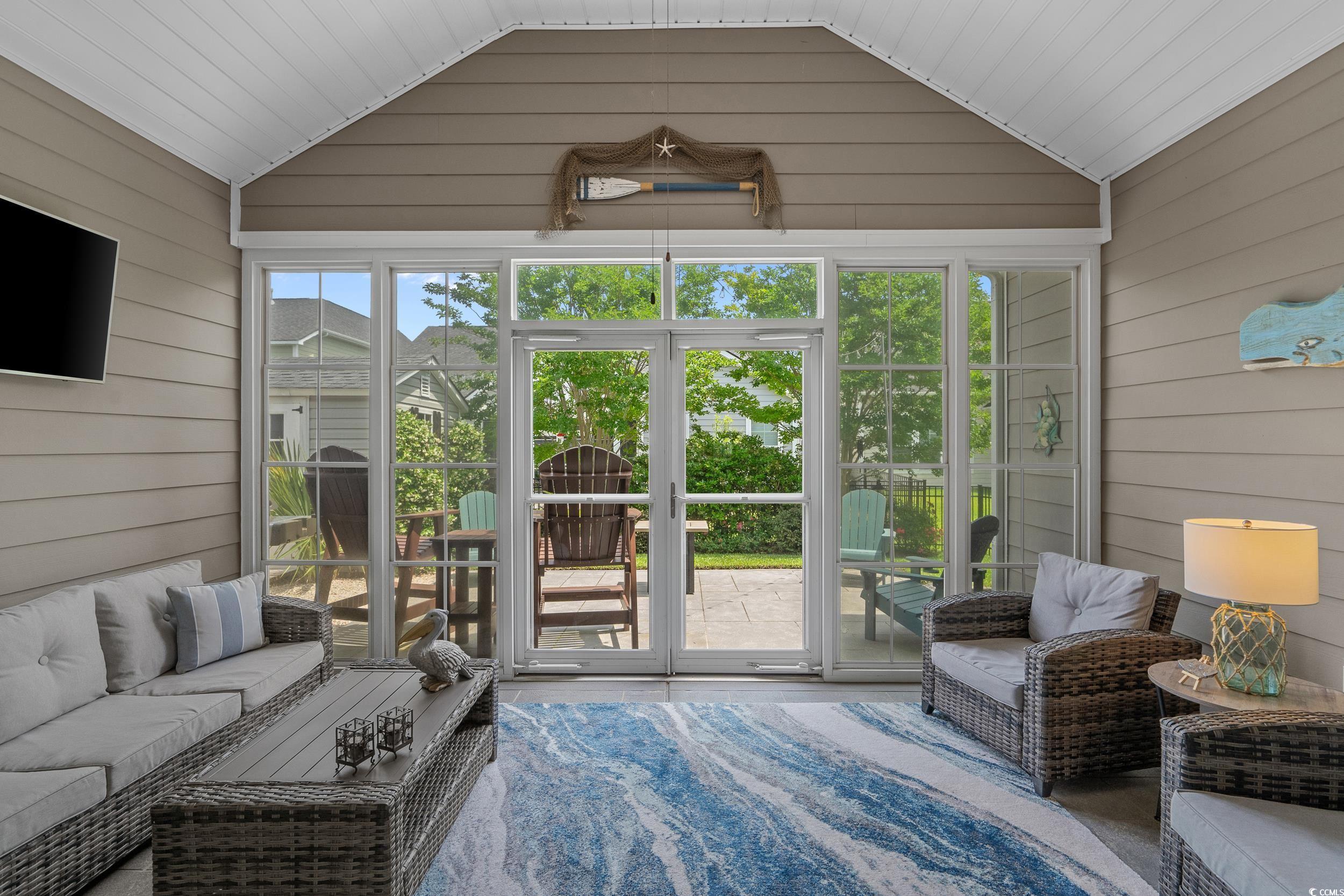 1380 Culbertson Avenue Myrtle Beach, SC 29577 - Photo 23 of 50 Sunroom with vaulted ceiling and an outdoor living space