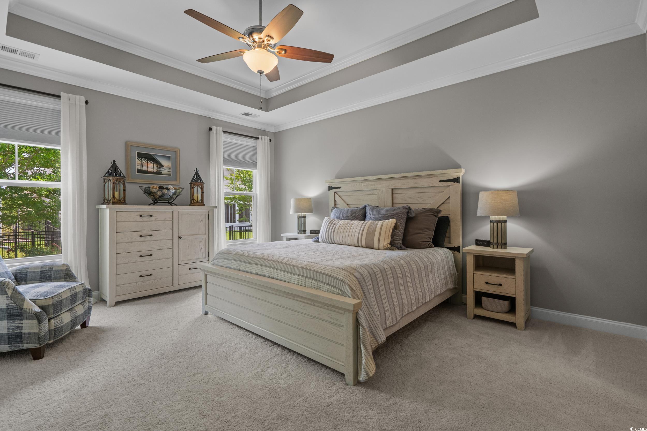 1380 Culbertson Avenue Myrtle Beach, SC 29577 - Photo 31 of 50 Bedroom with a raised ceiling, light carpet, crown molding, ceiling fan, and baseboards