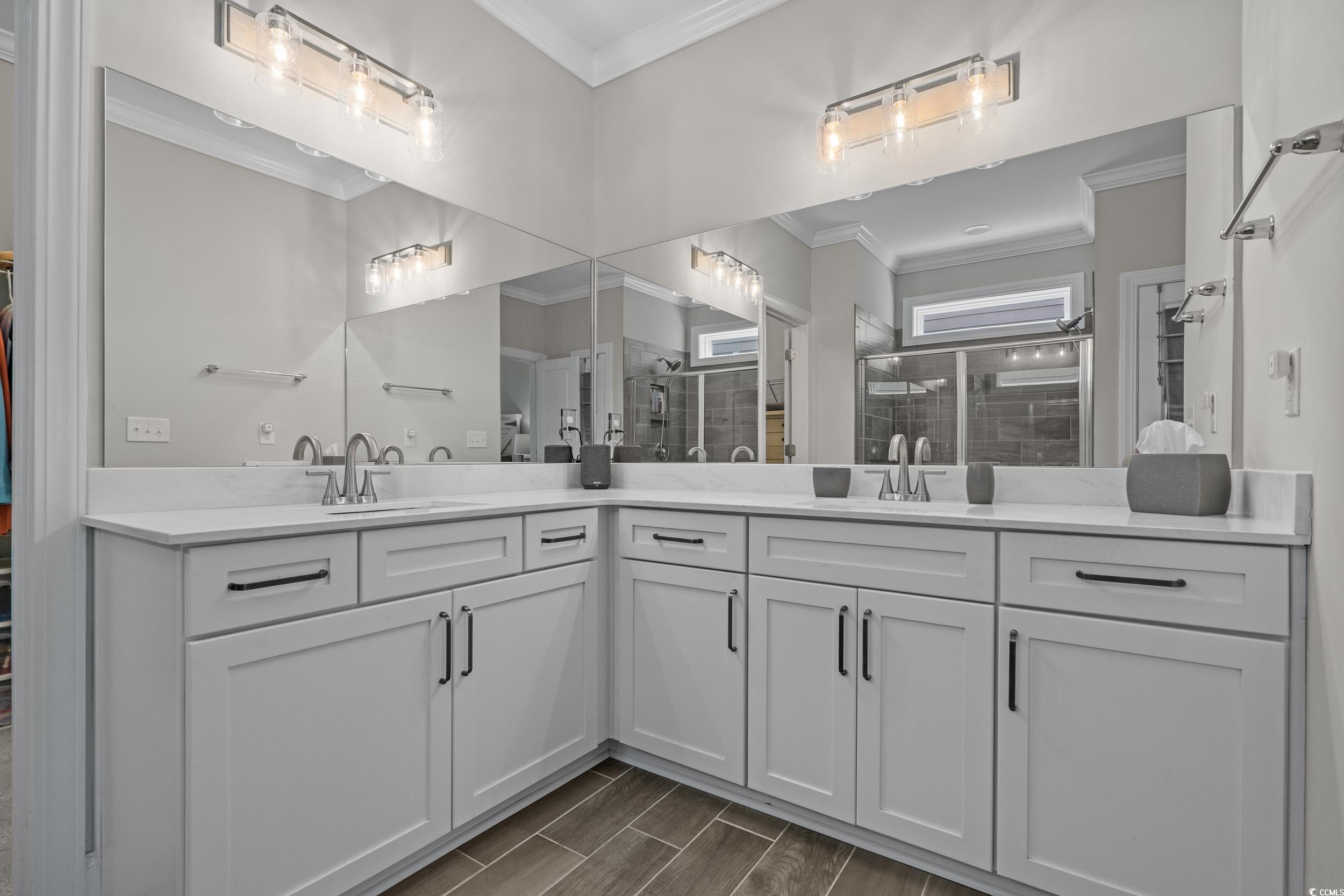 1380 Culbertson Avenue Myrtle Beach, SC 29577 - Photo 34 of 50 Bathroom with double vanity, crown molding, a stall shower, and wood tiled floors