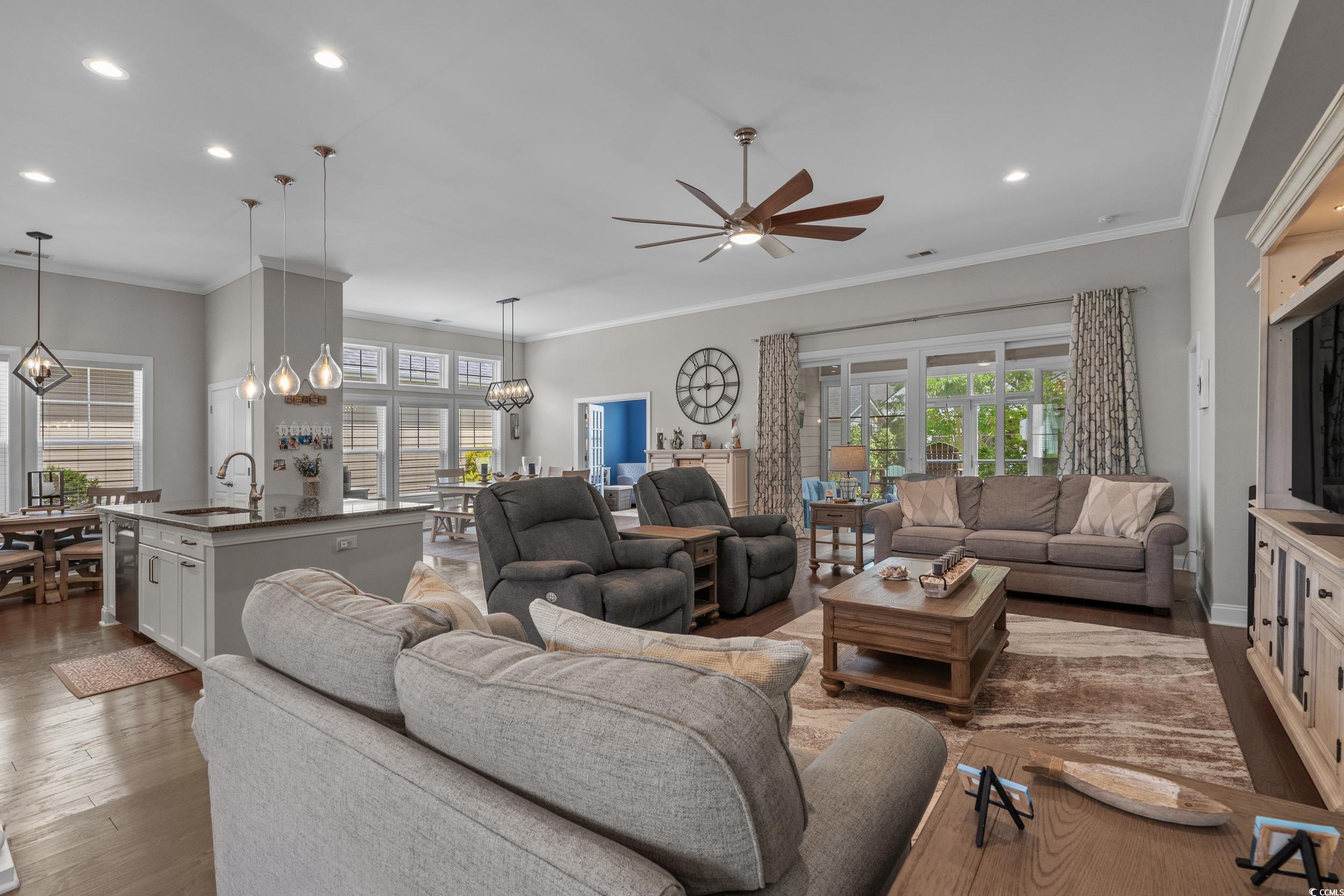1380 Culbertson Avenue Myrtle Beach, SC 29577 - Photo 8 of 50 Living area with a ceiling fan, recessed lighting, wood finished floors, ornamental molding, and a chandelier