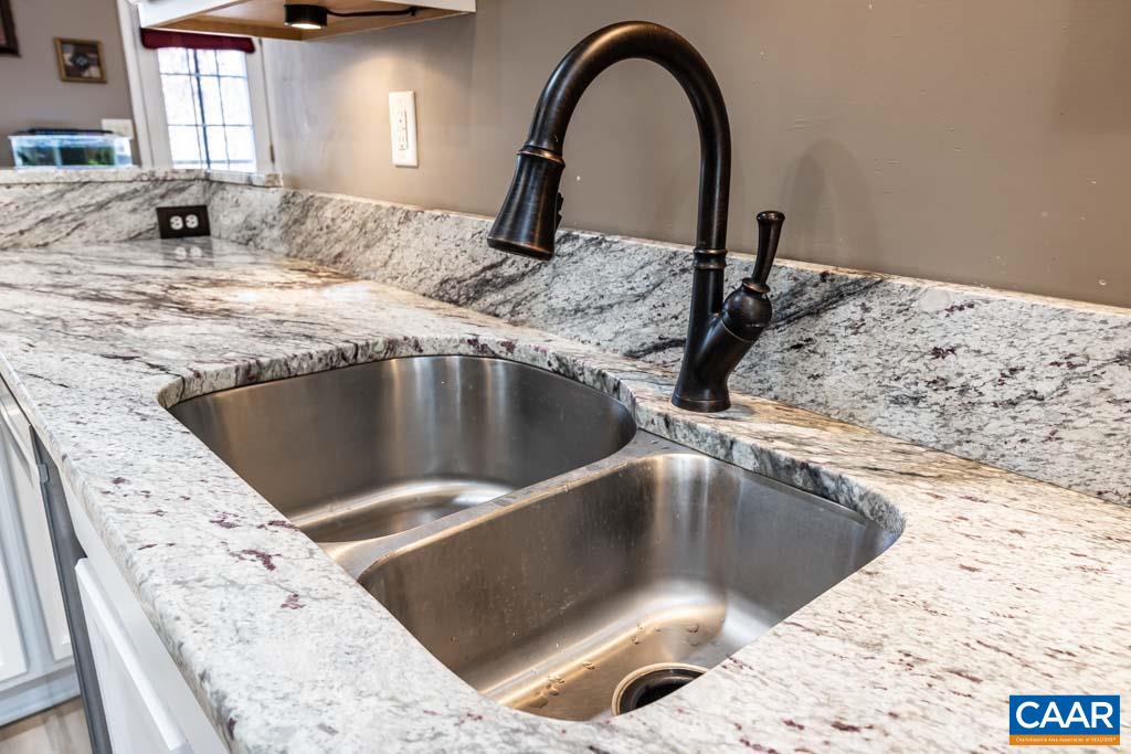 1605 Beautiful Run Road Aroda, VA 22709 - Photo 17 of 63 a kitchen with granite countertop a sink and a stove