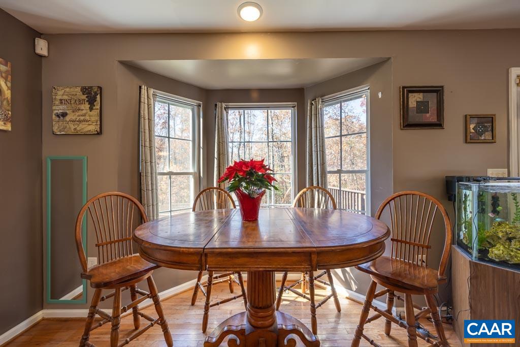 1605 Beautiful Run Road Aroda, VA 22709 - Photo 19 of 63 a view of a dining room with furniture window and wooden floor