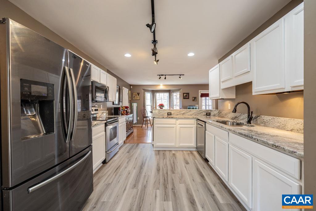 1605 Beautiful Run Road Aroda, VA 22709 - Photo 2 of 63 a kitchen with white cabinets and stainless steel appliances