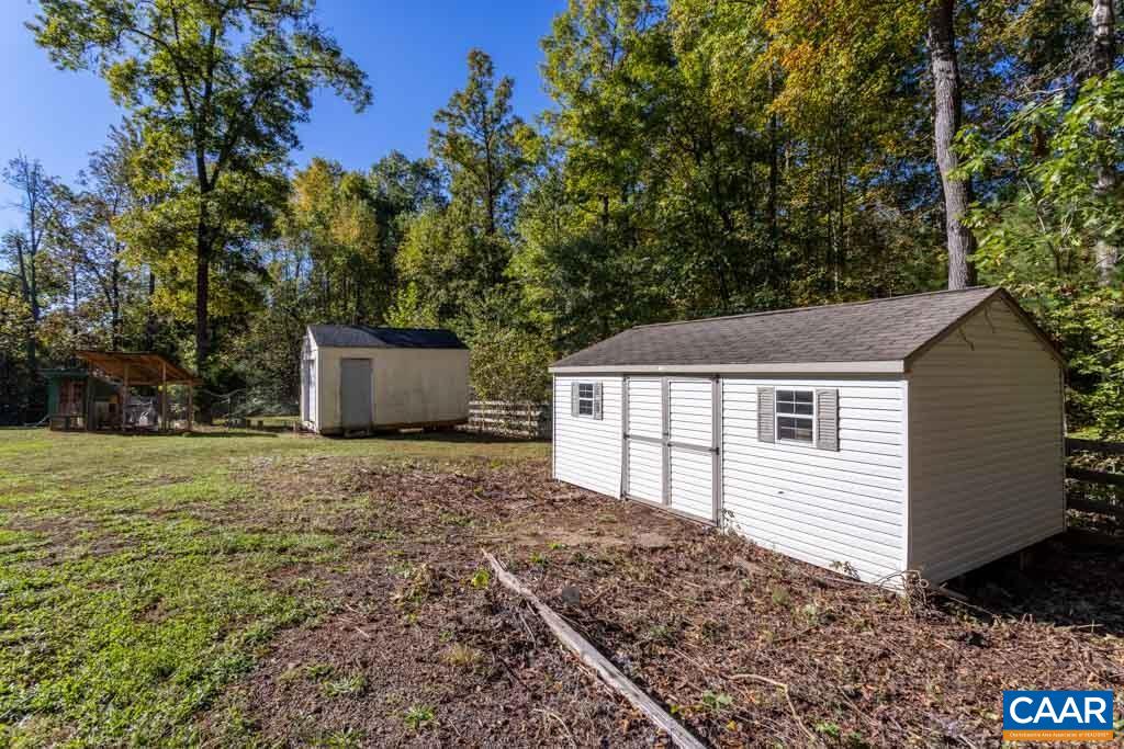 1605 Beautiful Run Road Aroda, VA 22709 - Photo 49 of 63 a house with trees in the background