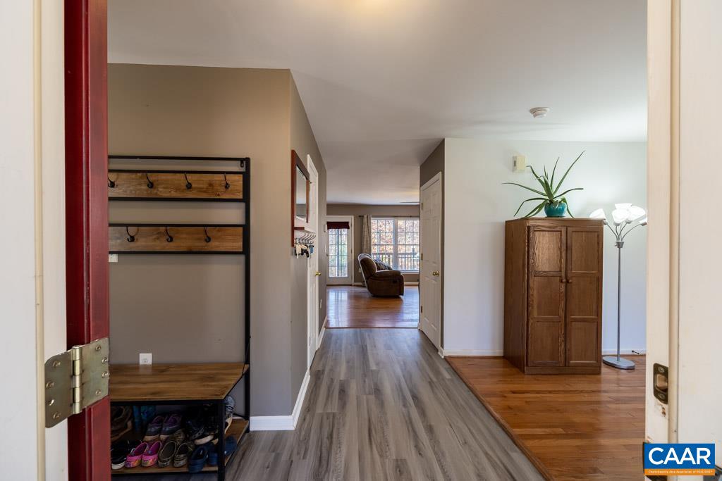 1605 Beautiful Run Road Aroda, VA 22709 - Photo 10 of 63 a view of a hallway with wooden floor and staircase