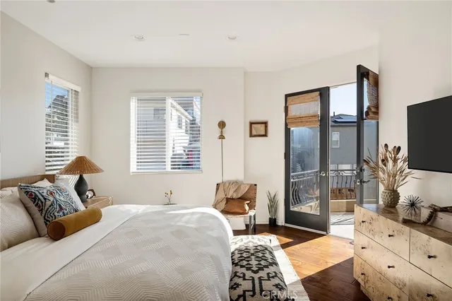 a view of a hallway with wooden floor and entryway