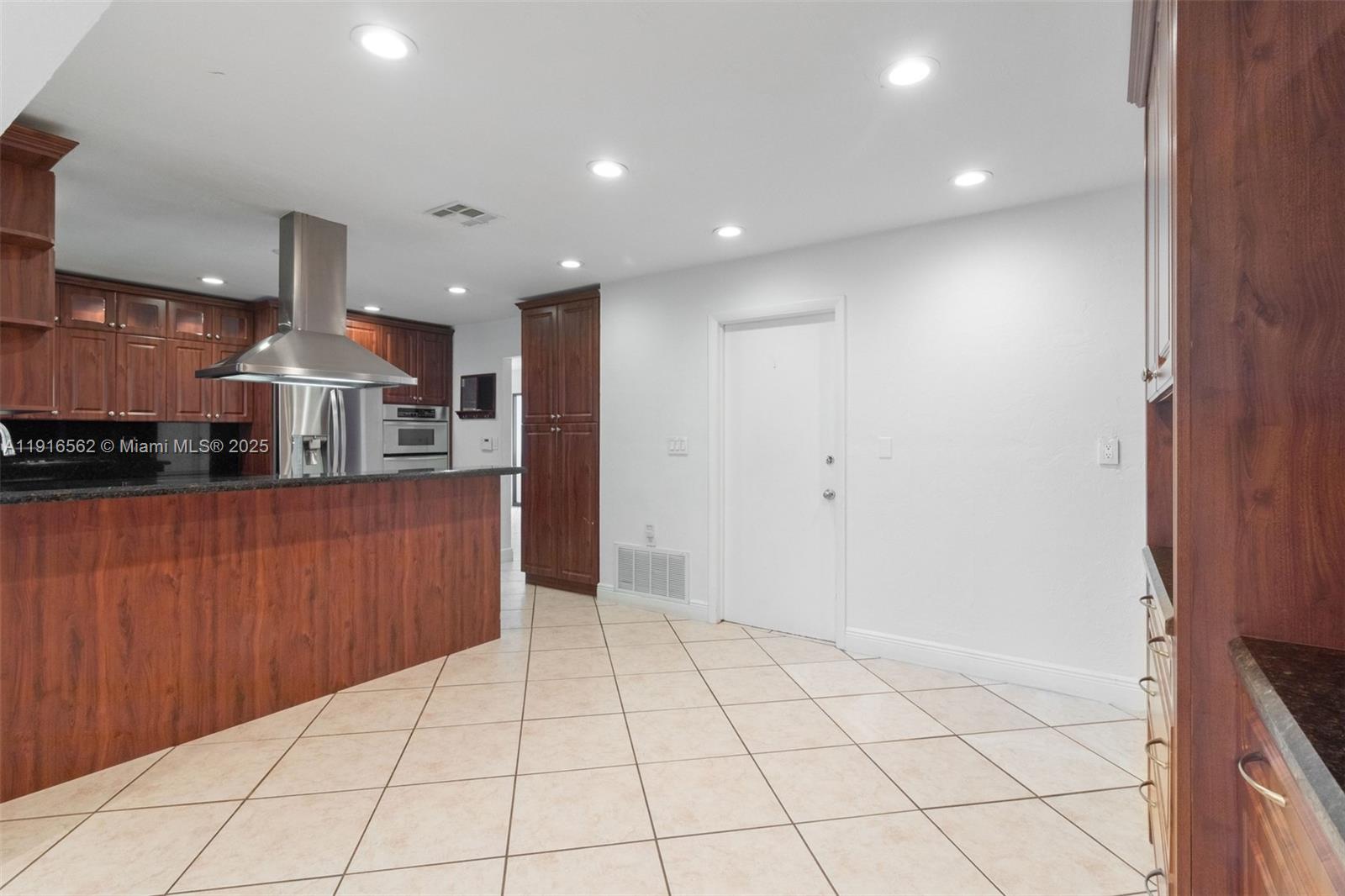 10485 Southwest 109th Street Miami, FL 33176 - Photo 14 of 45 a view of kitchen with wooden floor