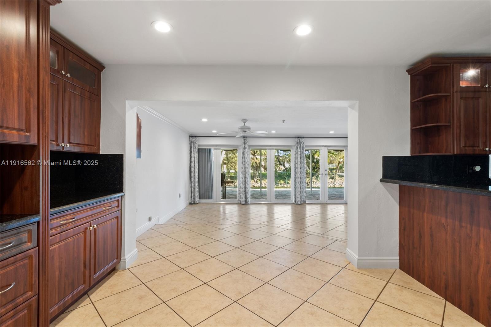 10485 Southwest 109th Street Miami, FL 33176 - Photo 16 of 45 wooden floor in an empty room with a window and wooden floor