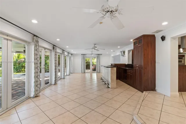 a view of kitchen with furniture and refrigerator
