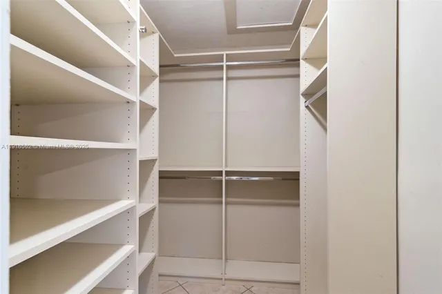 a view of an empty walk in closet