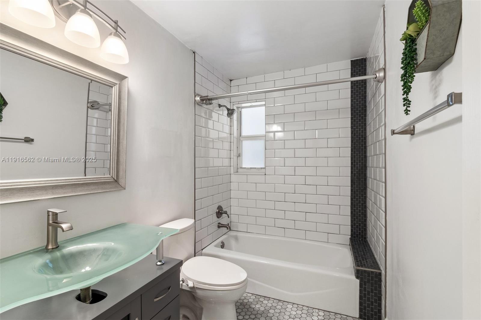 10485 Southwest 109th Street Miami, FL 33176 - Photo 30 of 45 a bathroom with a sink a toilet and shower