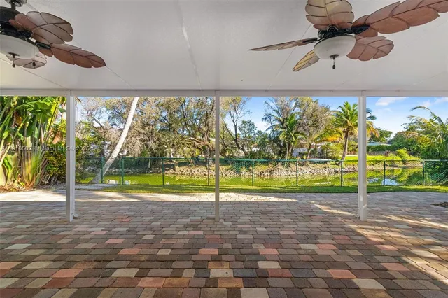 a view of a room with a big yard