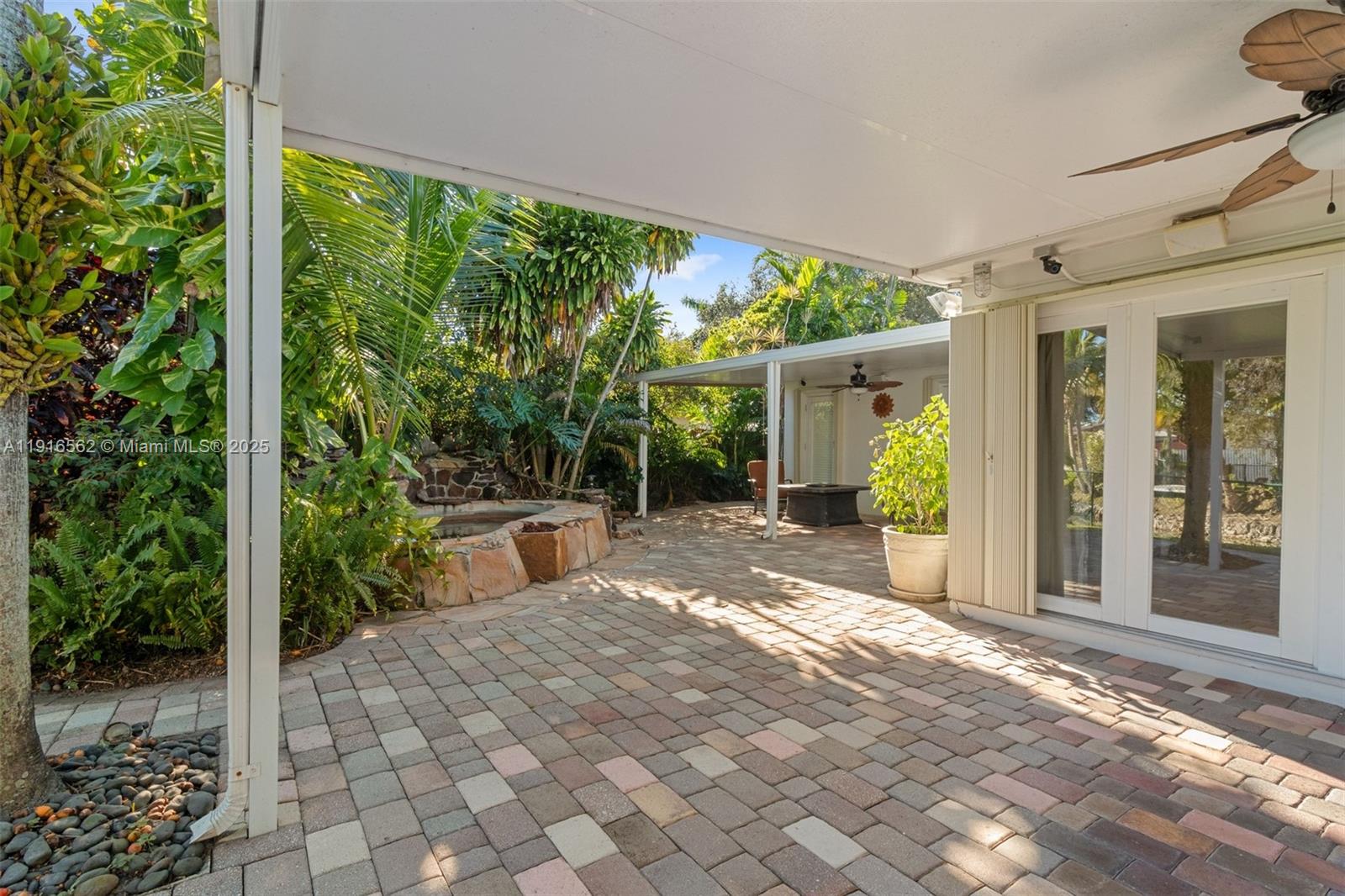 10485 Southwest 109th Street Miami, FL 33176 - Photo 40 of 45 a view of a patio with couches plants and large tree