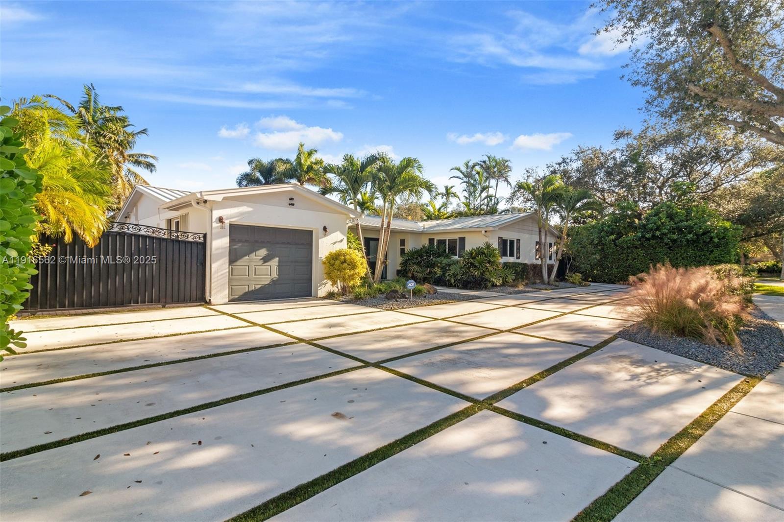 10485 Southwest 109th Street Miami, FL 33176 - Photo 44 of 45 a front view of a house with a yard