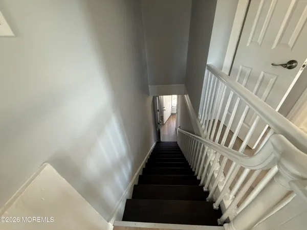 a bathroom with a sink a toilet a mirror and vanity