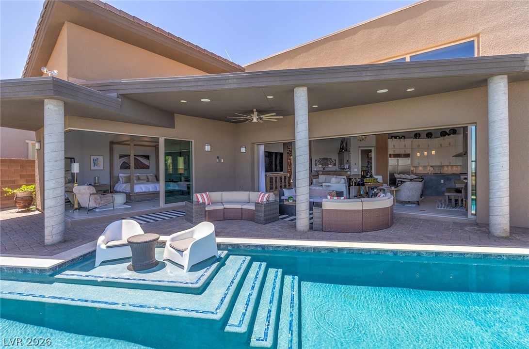 6014 Willow Ridge Court Las Vegas, NV 89135 - Photo 82 of 99 An inviting outdoor oasis with a shimmering pool, perfect for relaxation and entertaining.