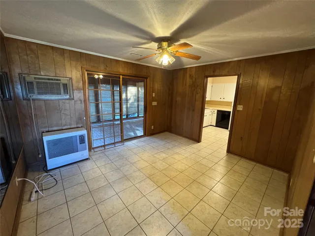 a view of a livingroom with a furniture and a ceiling fan