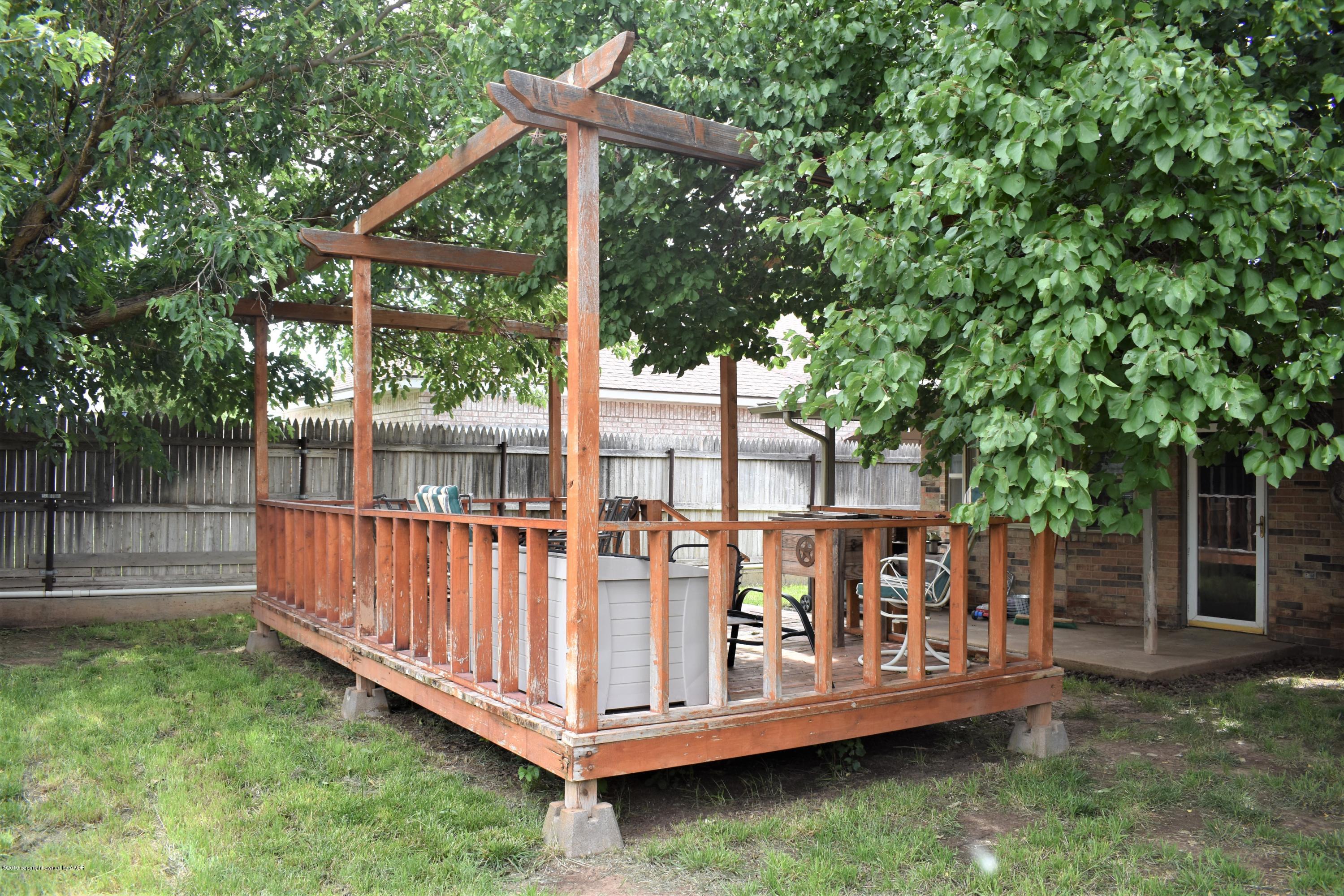 7902 Gerald Drive Amarillo, TX 79121 - Photo 17 of 17 a view of a wooden deck with a small yard