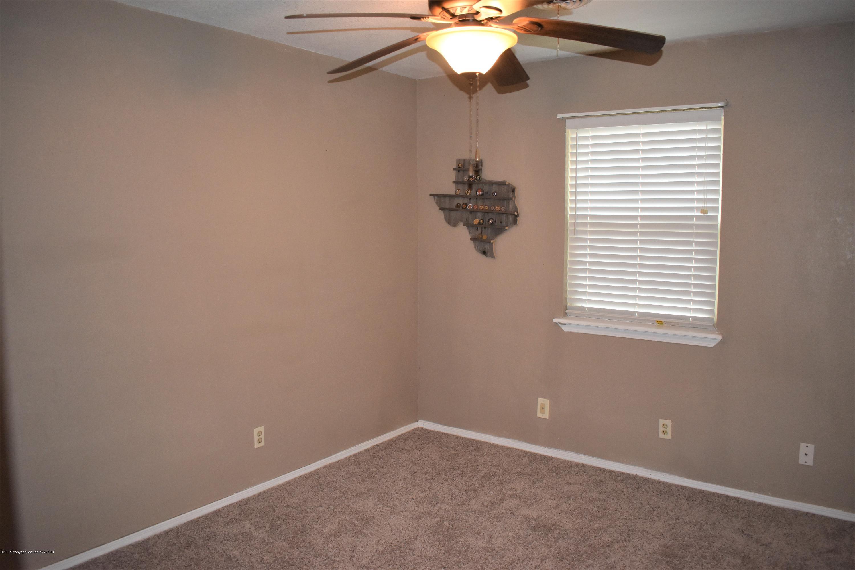 7902 Gerald Drive Amarillo, TX 79121 - Photo 6 of 17 an empty room with a window