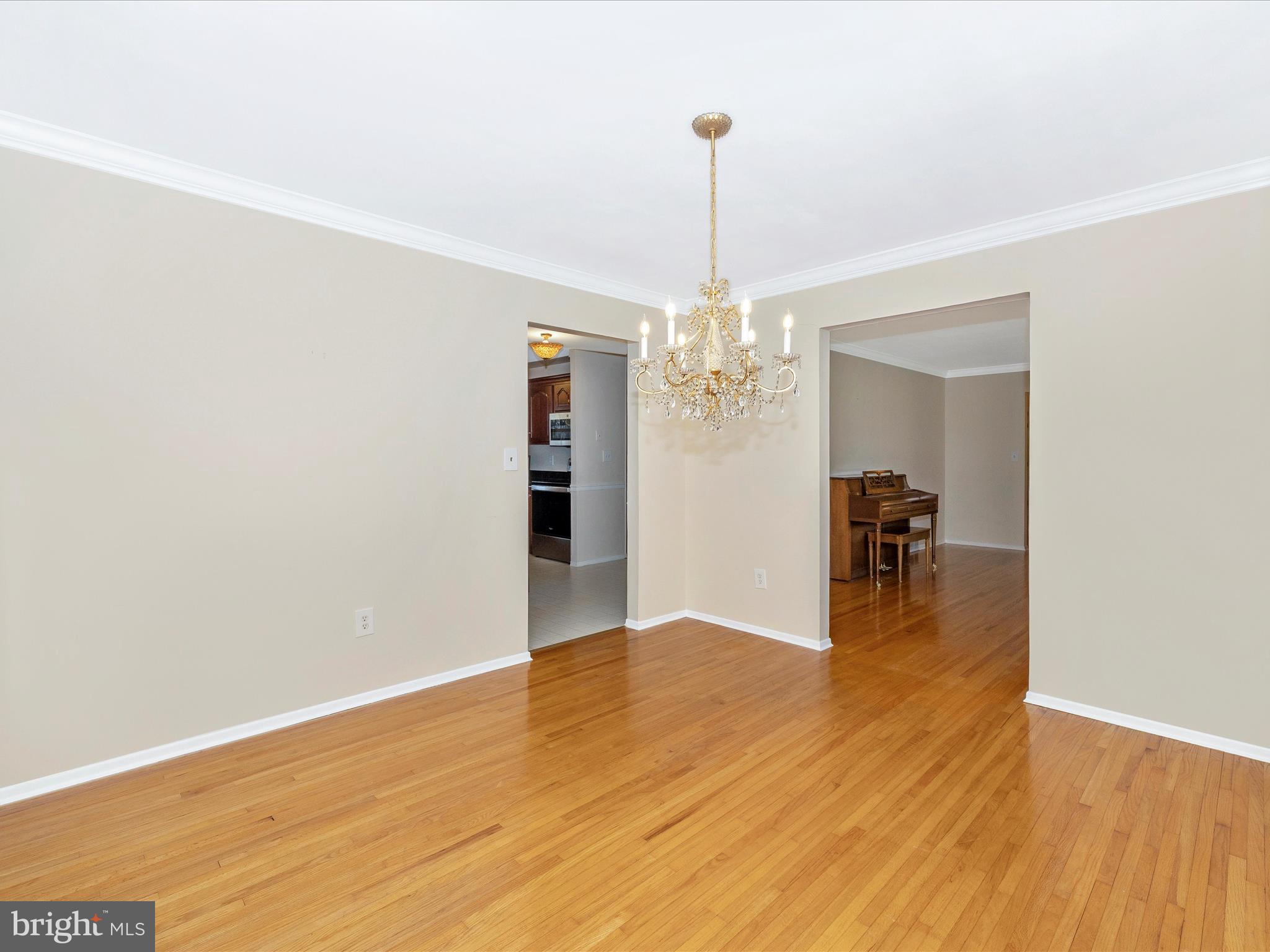 25204 Frederick Road Clarksburg, MD 20871 - Photo 13 of 58 a view of a livingroom with a chandelier