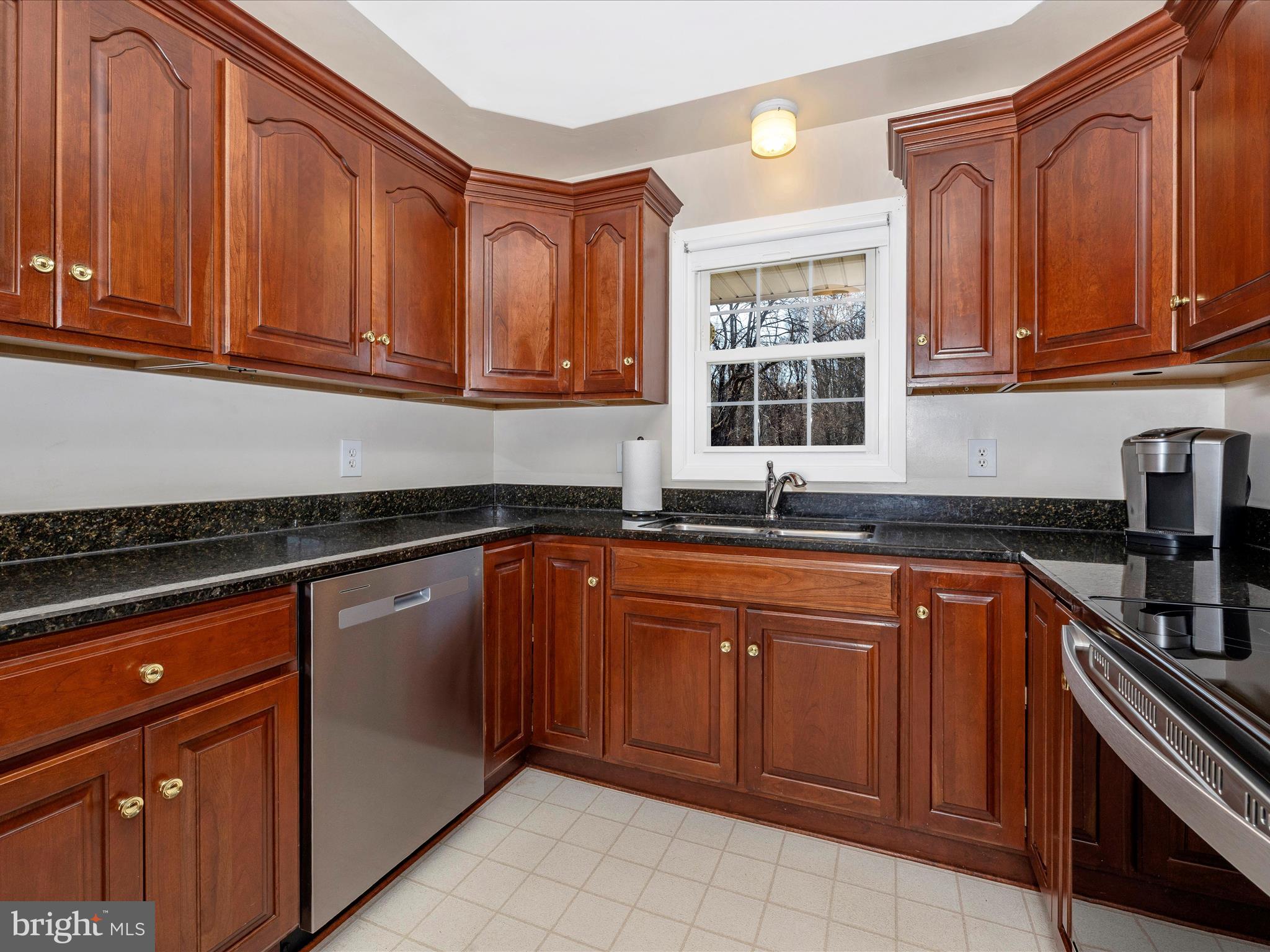 25204 Frederick Road Clarksburg, MD 20871 - Photo 15 of 58 a kitchen with stainless steel appliances granite countertop a sink dishwasher stove and cabinets