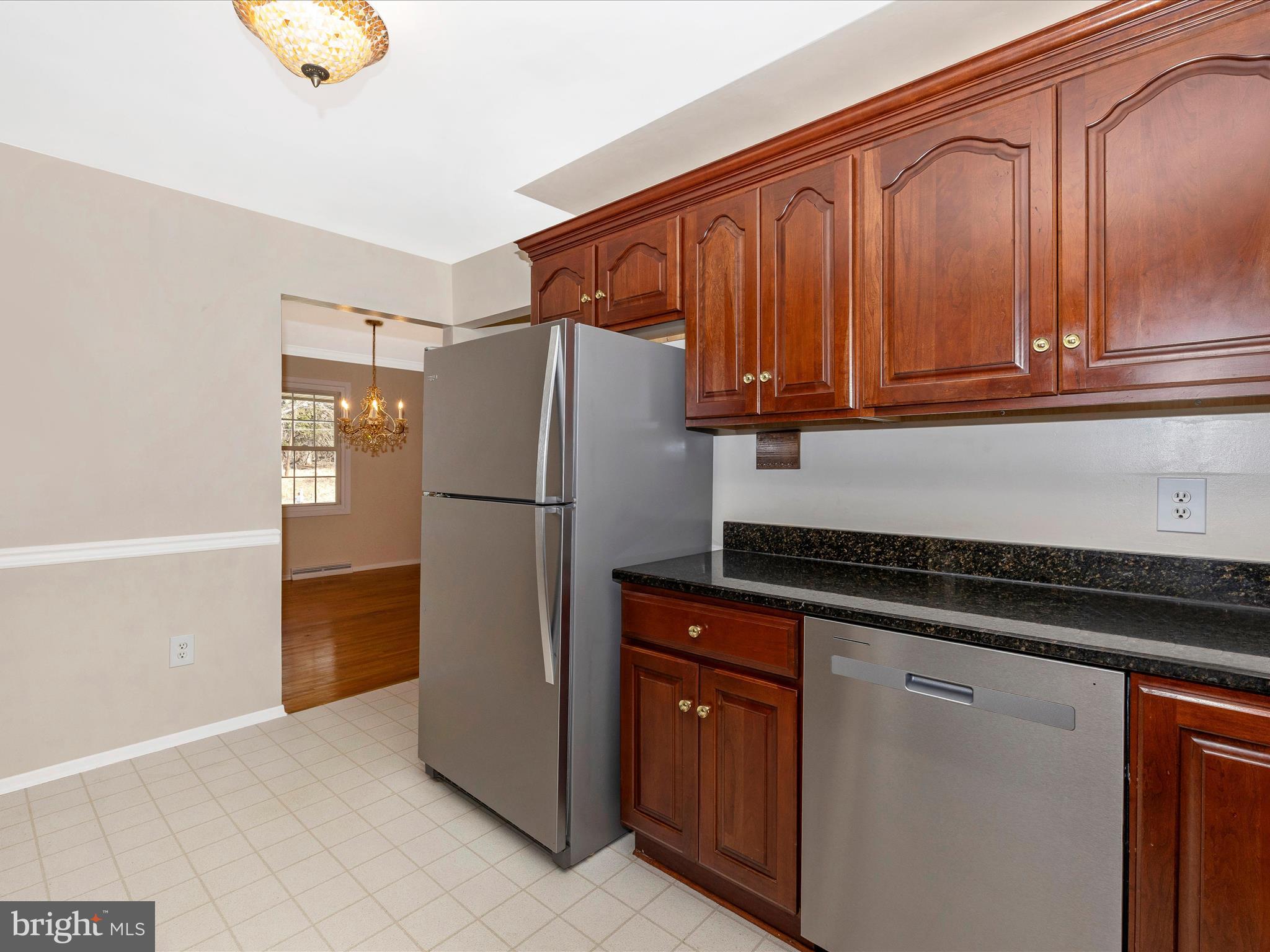 25204 Frederick Road Clarksburg, MD 20871 - Photo 19 of 58 a kitchen with stainless steel appliances granite countertop a refrigerator and a stove top oven